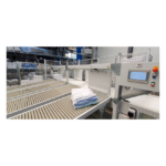 Foltex FlexSort met stapels gevouwen wasgoed op de transportbanen